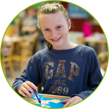 a girl working with a Montessori material at a Czech-English Montessori Elementary Duhovka