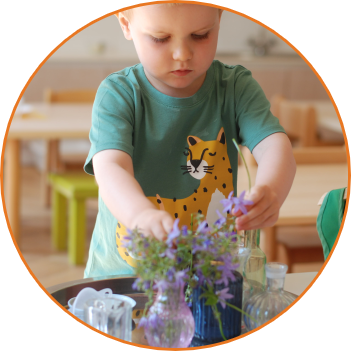 A toddler working in the Montessori toddler class Duhovka