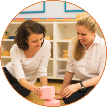 Two teachers working with Montessori materials in the Duhovka Institute